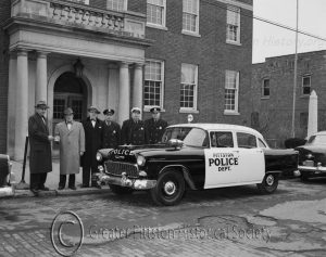Police Chief Patrick O'Brien with cruiser, c.1952. Photograph, courtesy of the Greater Pittston HIstorical Society.